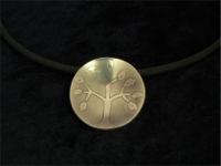 Etched and domed nickel silver pendant on black PVC cord